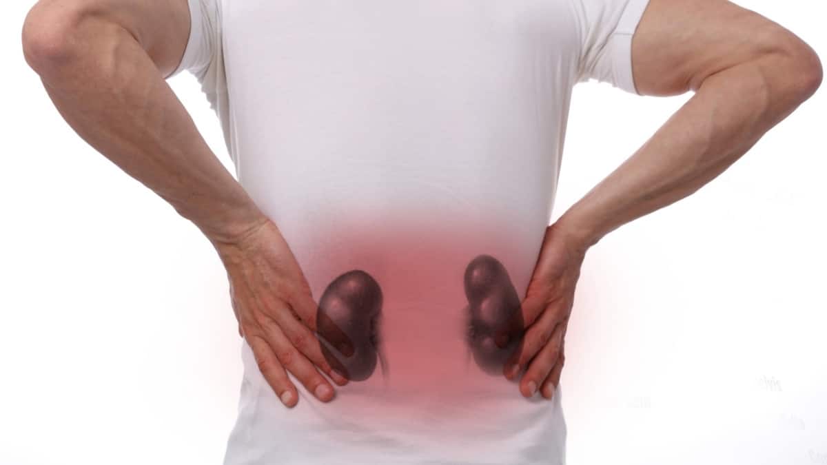 a man having severe side and back pain due to Chronic Kidney Disease