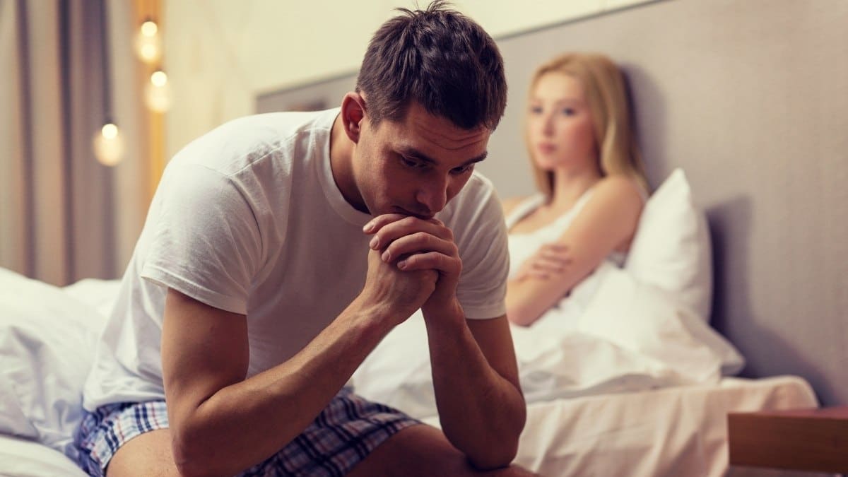 A man facing difficulty in getting intimate with spouse due to impotence