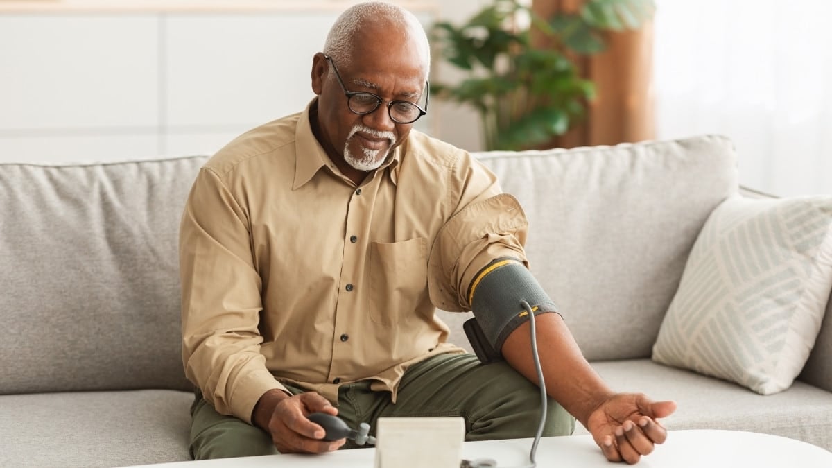 A man taking the blood pressure reading to manage pulmonary arterial hypertension