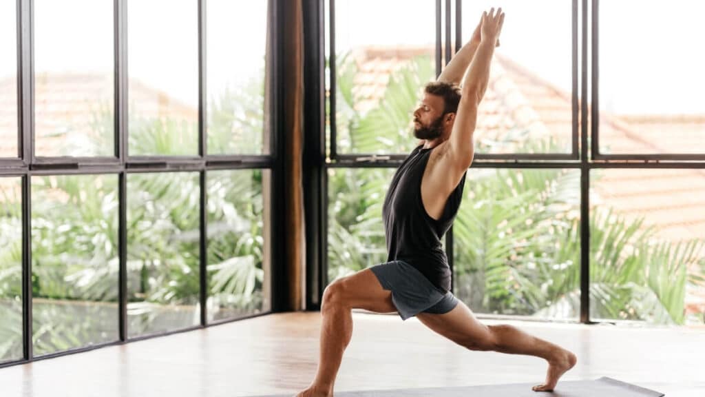 man performing a yoga asana for health benefits