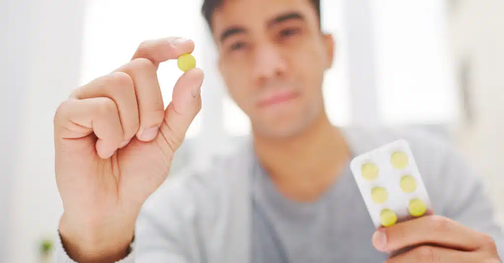 Man taking pills