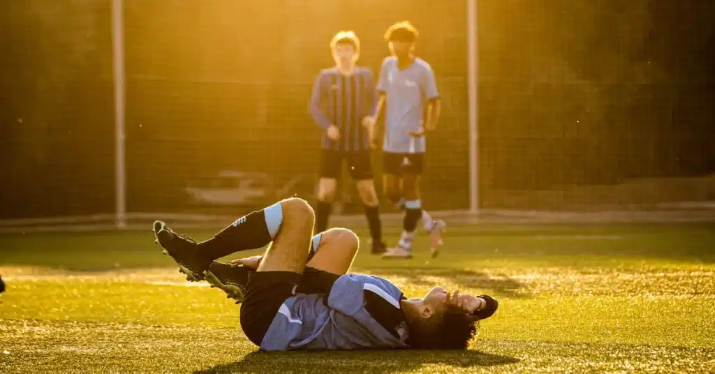 A boy injured while playing sport.