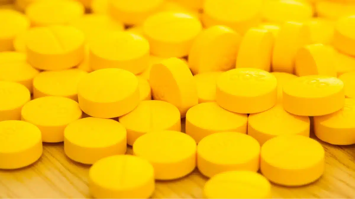 Yellow levitra pills on the floor