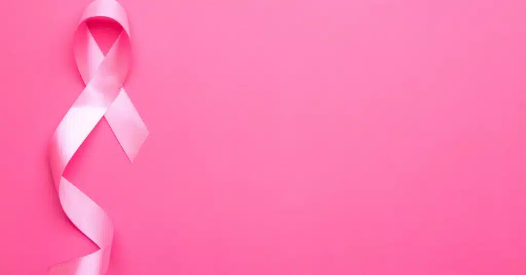 A ribbon shaped in the cancer support symbol