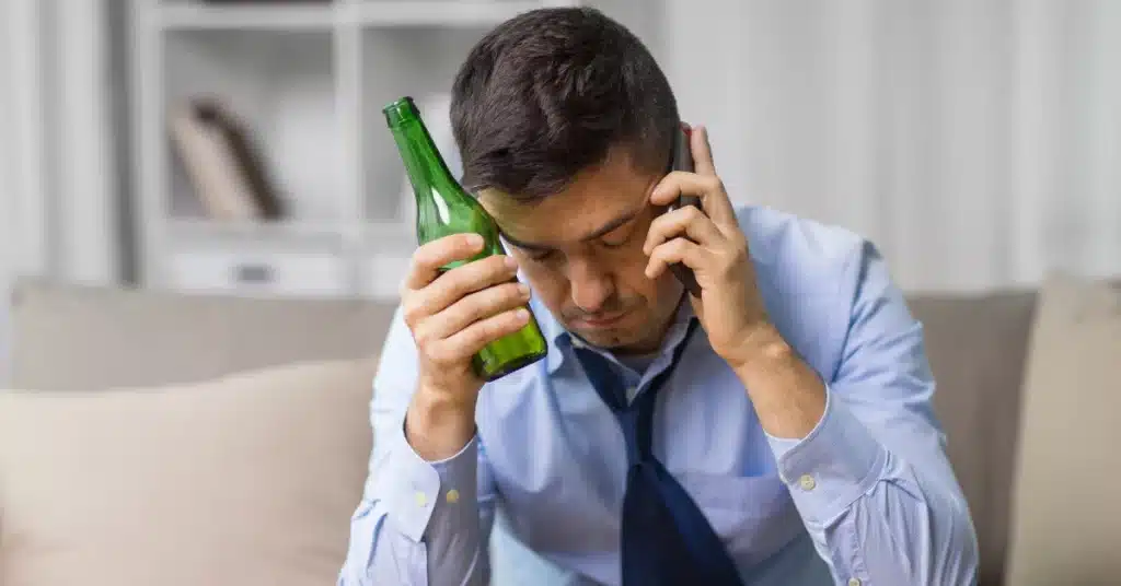 Stressed man while drinking alcohol