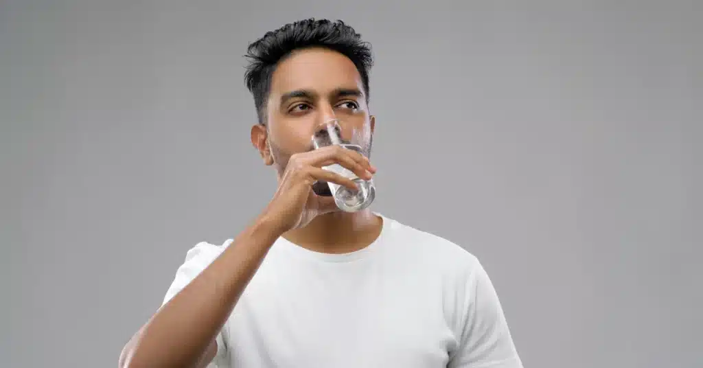 man drinking water