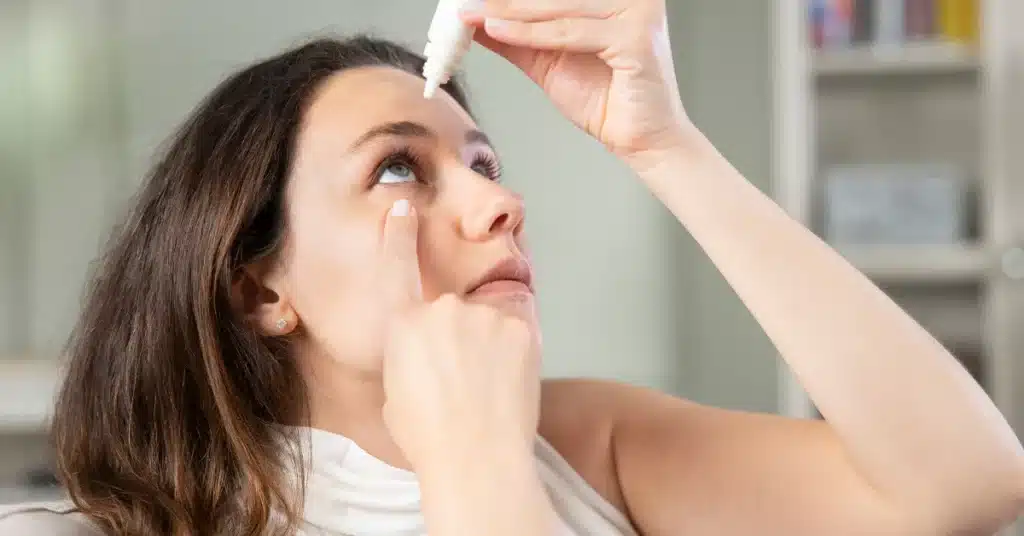 Woman using eye drop