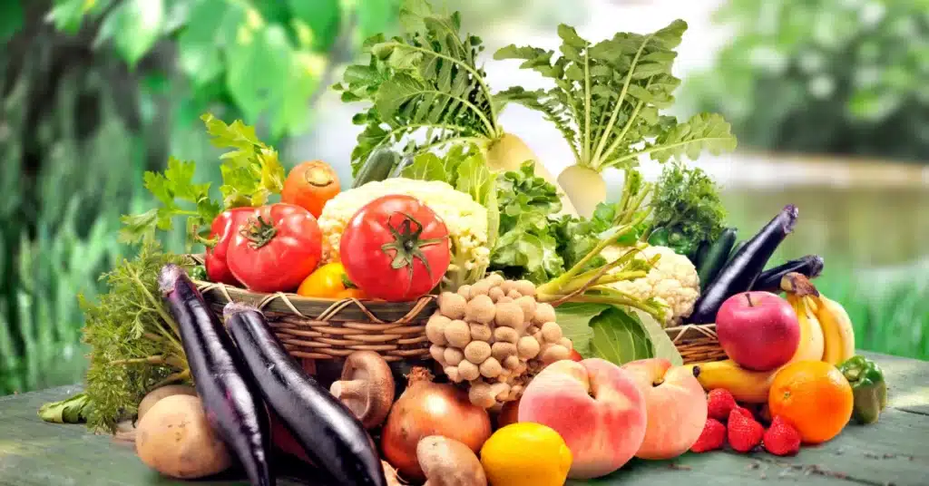 fresh fruits and vegetables kept on wooden table