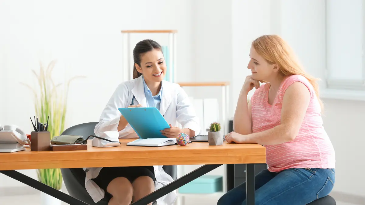 Woman consulting doctor