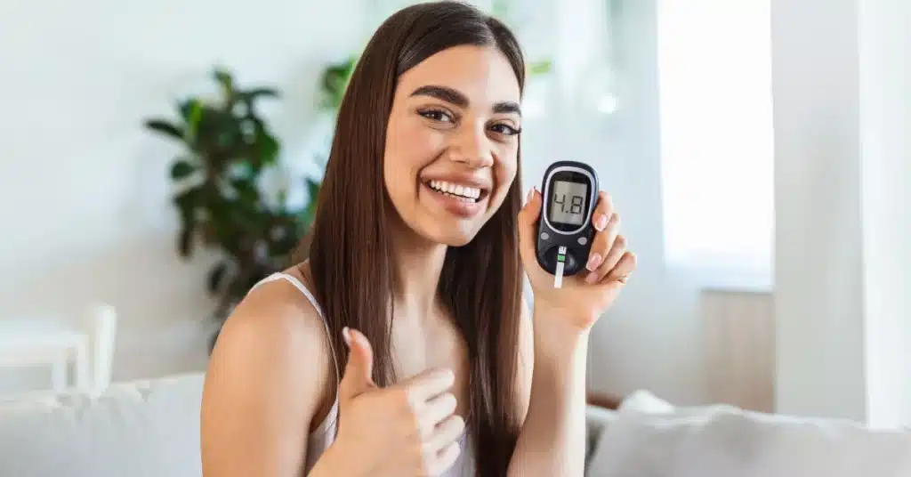 Woman testing blood sugar level