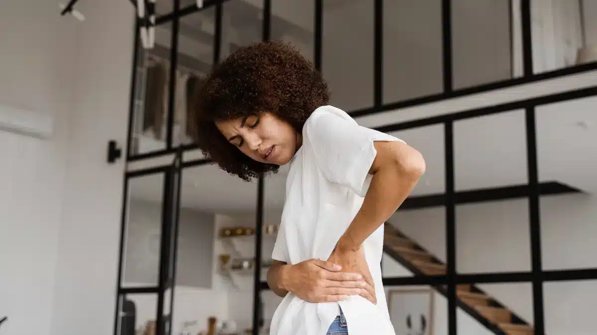 A woman experiencing ovarian pain