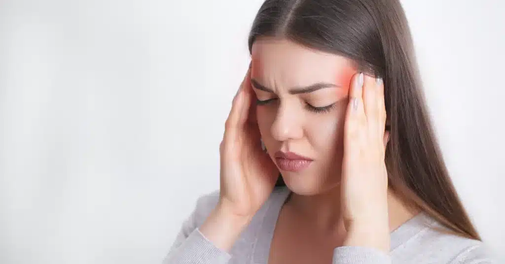 Woman suffering from severe headache