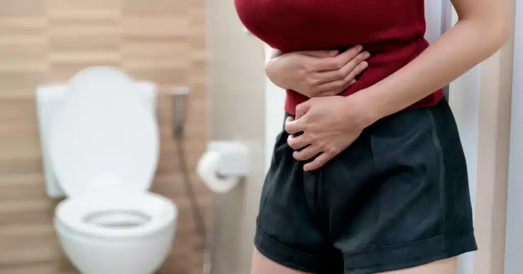 Woman suffering from diarrhea
