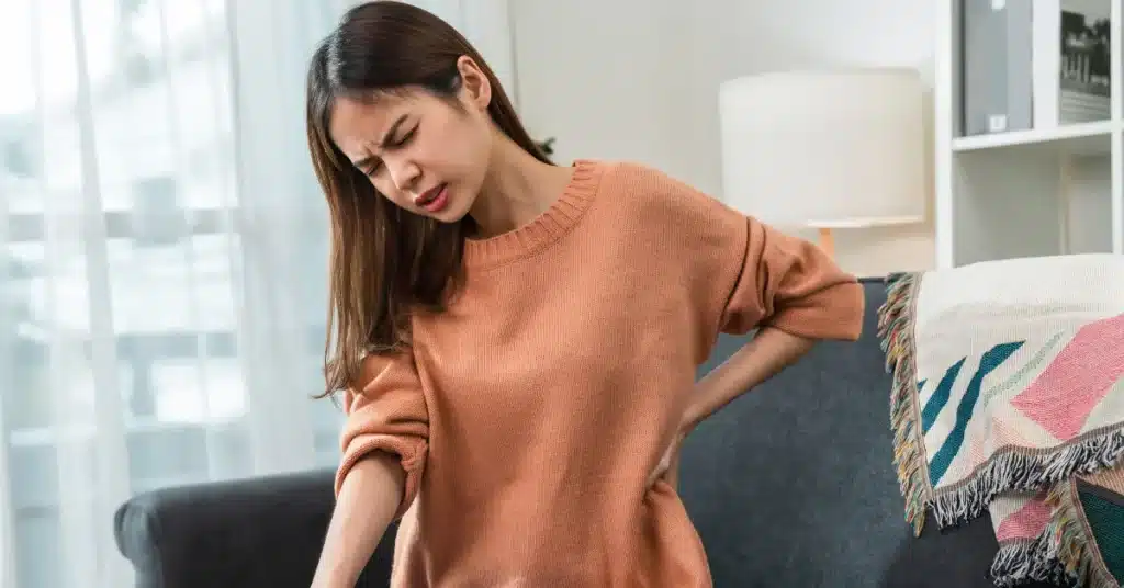 Woman suffering from back pain