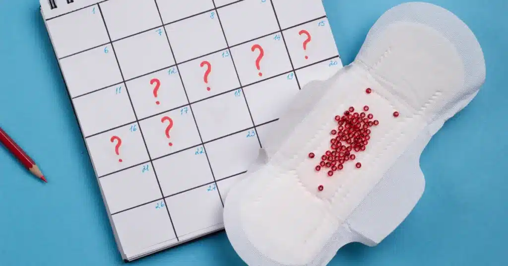 question marks on a calender and sanitary pad