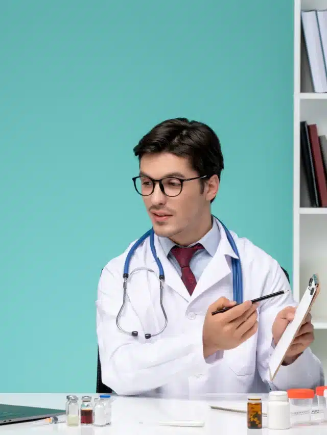 medical-serious-smart-doctor-lab-coat-working-remotely-computer-explaining-prescription